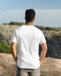 slim-man-sitting-on-sofa-wearing-tshirt-mockup1